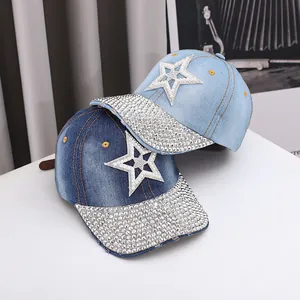 Detail of star-patterned denim baseball cap with sparkling rhinestones and pearls