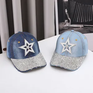 Detail of denim baseball caps featuring pearl five-pointed stars and shiny silver rhinestones