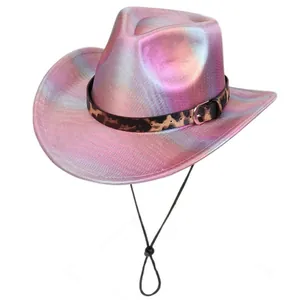 Detail of pink holographic cowboy hat with metallic mesh texture and leopard print band