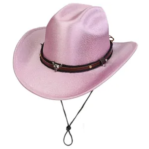 Detailed view of pink sequin cowboy hat with metallic bull skull charm and leather band