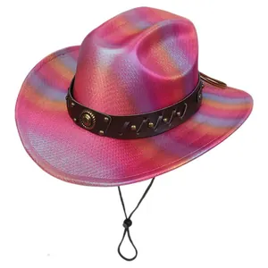 Detail of pink gradient cowboy hat with laser finish, leather band and metal emblem