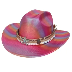 Close-up of pink and gold metallic cowboy hat with star charms and studded band details