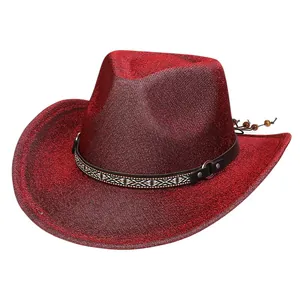 Detail of red glitter cowboy hat featuring black leather band and tribal pattern