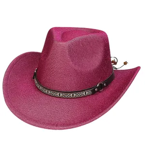Detail of magenta cowboy hat with ethnic patterned band and silver metal rivets