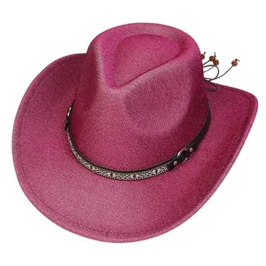 Detail of pink glitter cowboy hat with ethnic braided band and wooden beads decoration