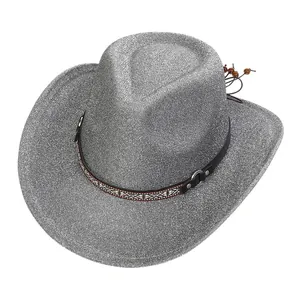 Detail of silver glitter cowboy hat showing shiny texture and ethnic decorative band