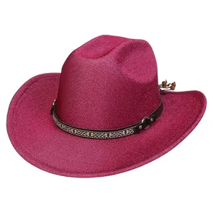 Detail of fuchsia glitter cowboy hat with ethnic embroidered band and bead accents