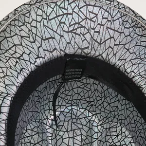 Detail of laser silver geometric hat with 100% polyester label and black sweatband