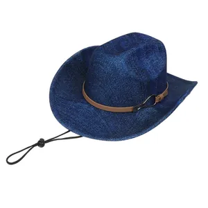 Detail of blue denim textured cowboy hat with brown leather band and windproof cord