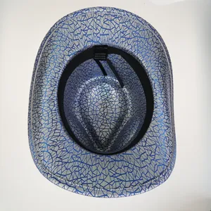 Close-up of internal lining, 100% polyester label and silver crackle texture on cowboy hat