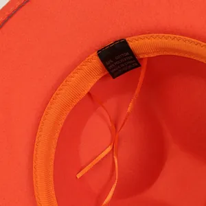 Detail of orange fedora interior featuring cotton-polyester blend lining and sweatband