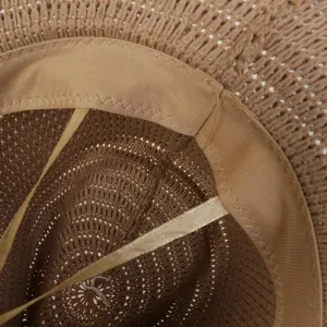 Macro shot of cowboy hat interior showing the sweatband and adjustable drawstring strap