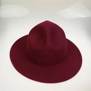 Top view of a burgundy fedora hat with a flat brim and high-quality wool felt texture
