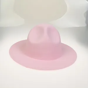 Detail shot of a pink wool felt fedora showing the wide brim and reinforced stitching