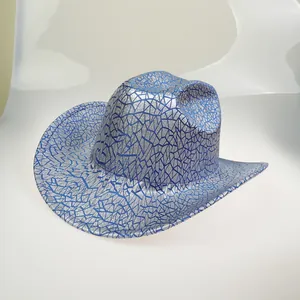 Detail view of silver cowboy hat with blue geometric cracked pattern and wide rolled brim