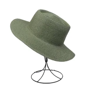 Detail of army green straw hat showing fine woven texture and flat brim structure
