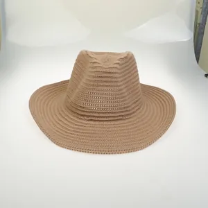 Detailed view of khaki woven cowboy hat featuring spiral texture and wide brim design