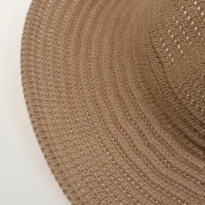 Close-up of the intricate texture and khaki straw weaving on this wide brim fedora hat