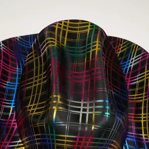 Detailed macro view of rainbow iridescent metallic grid lines on black felt cowboy hat
