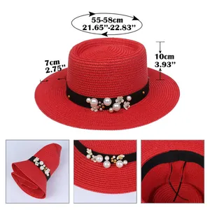 Detail view of red straw sun hat showing dimensions, folding feature, and floral pearls