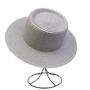 Detailed close-up showing the fine texture of a gray woven boater hat on a stand