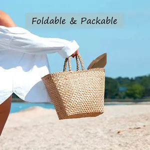 Foldable brown straw sun hat and matching tote bag shown in a beach holiday setting