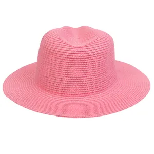 Macro detail of high-quality pink woven texture on a classic Panama straw sun hat