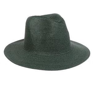 Detail view of dark green straw panama hat with fine weave and classic fedora dent