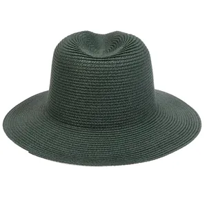 Detailed view of dark green Panama straw hat with spiral weave texture and indented crown