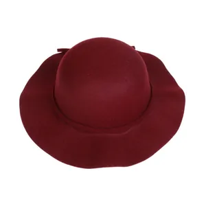 Detail view of the wide wavy brim and wool felt texture on this elegant burgundy fedora hat