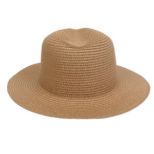 Detailed view of the woven texture and classic Fedora crown of this wide brim straw hat