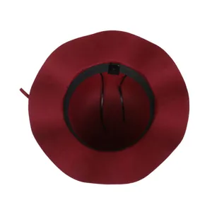 Detail of wine red wool-like hat showing inner lining, sweatband and size label