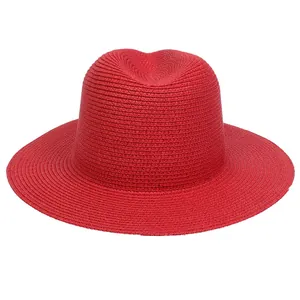 Detailed view of the woven texture and classic crown on this red Panama straw hat