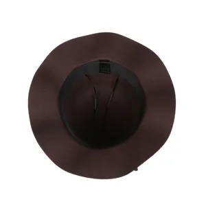 Internal detail of a dark brown felt hat showing the sweatband and material care label