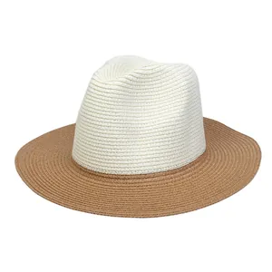 Detail of two-tone woven fedora hat with white crown and brown wide brim for sun protection