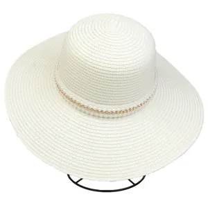Close-up of wide brim straw hat featuring double white pearls and golden chain detail