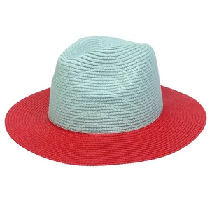 Detail of two-tone Fedora straw hat showing red brim and light blue crown weave
