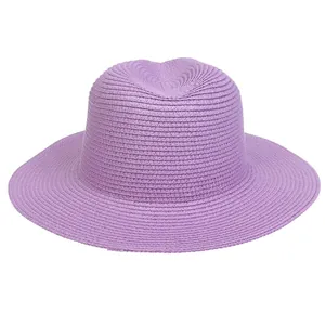 Detail of light purple woven straw panama hat with wide brim and fedora crown