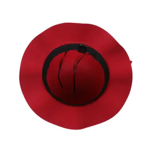 Interior detail of red wool felt hat showing black sweatband and adjustable drawstring