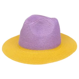 Detail of two-tone woven straw panama hat in violet and yellow with fine spiral texture