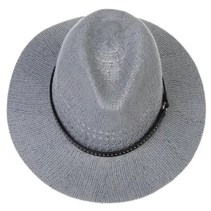 Close-up of gray woven straw hat featuring a black leather band with metal rivets
