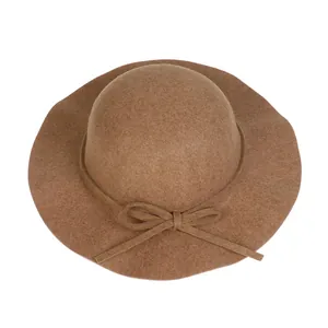 Detail view of khaki wool felt dome hat with elegant wide brim and bow decoration