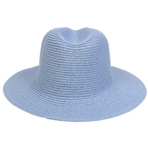 Detail of light blue wide brim straw Panama hat showing intricate woven texture and sun protection