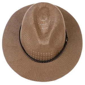 Top view of woven fedora hat with silver rivets and decorative brown faux leather band