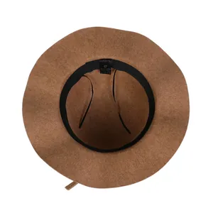 Detail view of the brown wool-felt fedora hat interior with adjustable strap and label