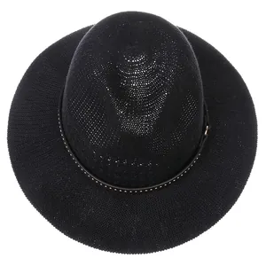 Detailed view of black woven fedora hat with silver-studded decorative band and texture