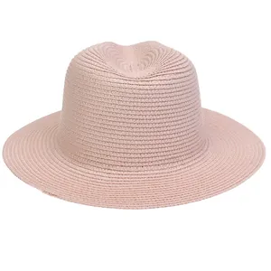 Detail of light pink Panama straw hat showing fine woven texture and flat wide brim