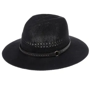 Detail of black woven fedora hat featuring a studded leather band and metal buckle