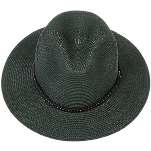 Detailed texture of dark green straw fedora hat with black studded band and wide brim
