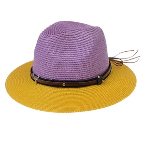 Detail of purple and yellow straw fedora with leather band and metal bull charm